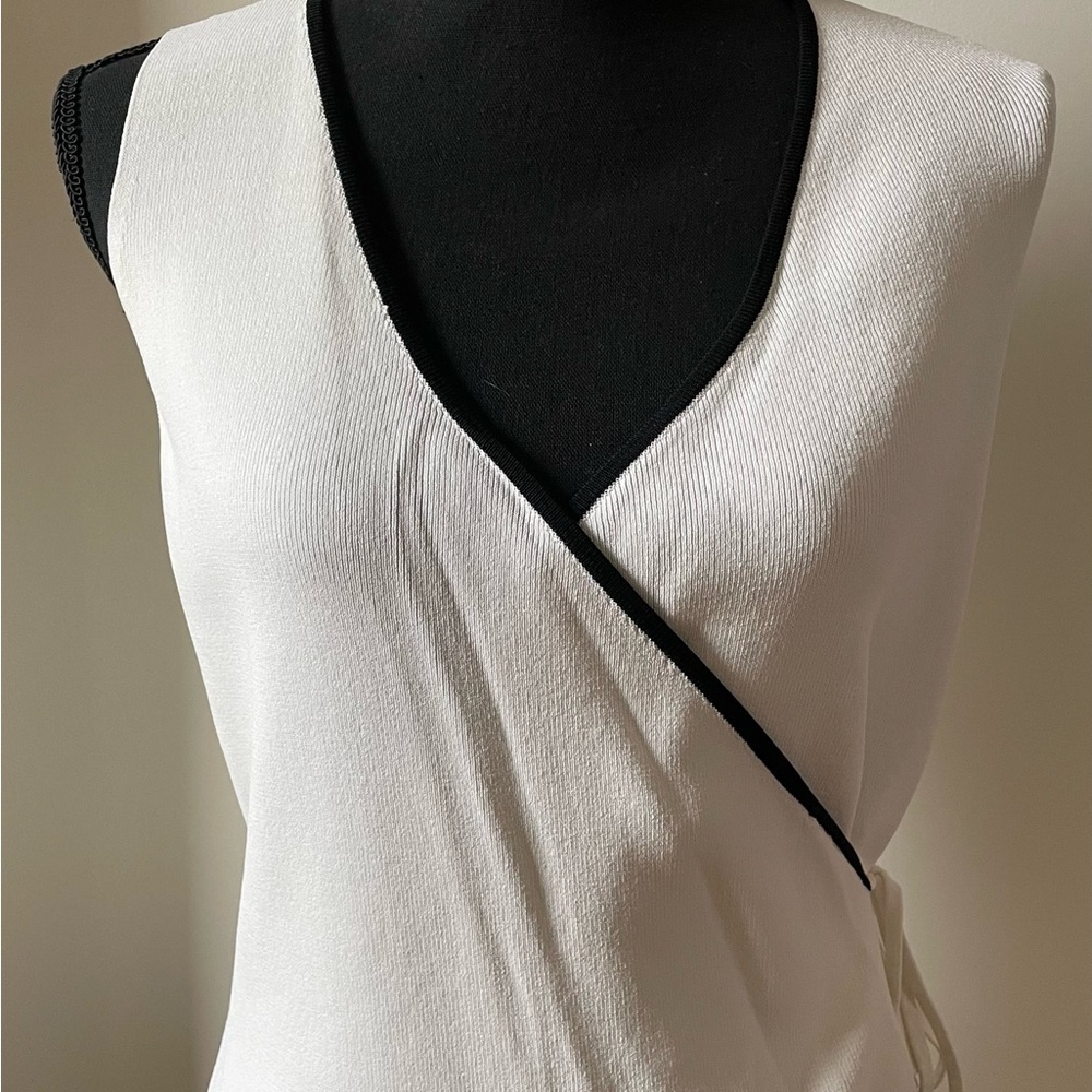 Chic White Wrap Top with Black Trim by Cyrus